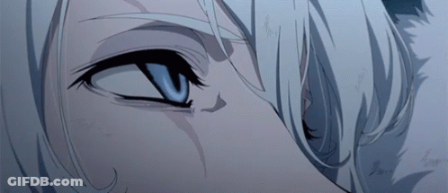 A Close Up Of A Person 'S Blue Eye With White Hair GIF