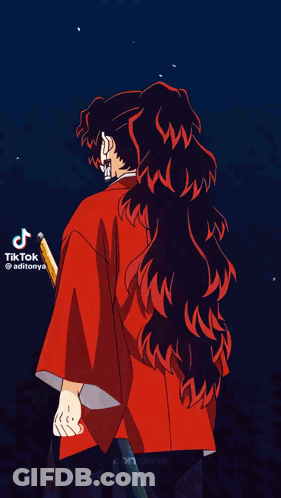 A Close Up Of A Person 'S Ear With A Ponytail And A Red Jacket . GIF