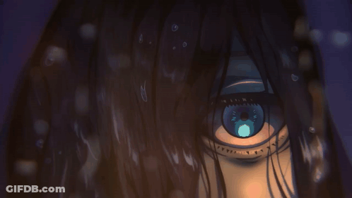 A Close Up Of A Person 'S Eye With A Blue Iris GIF