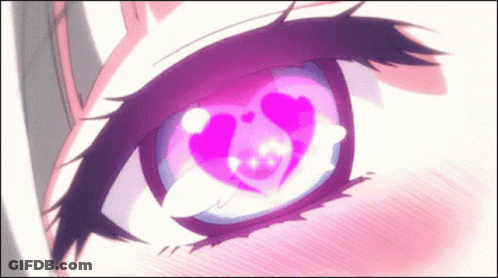 A Close Up Of A Person 'S Eye With A Heart In It . GIF