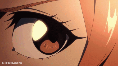 A Close Up Of A Person 'S Eye With A Light Coming Out Of It GIF
