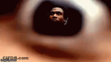 A Close Up Of A Person 'S Eye With A Man 'S Face Visible GIF