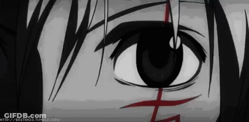 A Close Up Of A Person 'S Eye With A Red Cross On It .. GIF