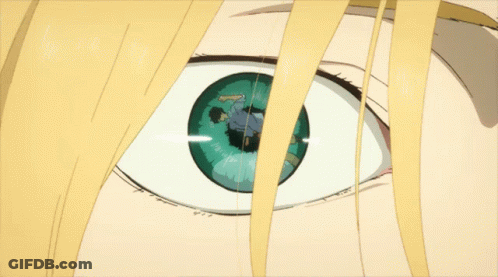 A Close Up Of A Person 'S Eye With A Reflection Of A Man In It GIF