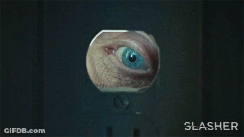 A Close Up Of A Person 'S Eye With The Word Slasher Below GIF