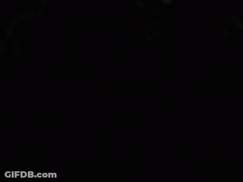 A Close Up Of A Person 'S Eyes In The Dark GIF