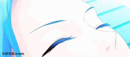 A Close Up Of A Person 'S Eyes With A Blue Iris GIF