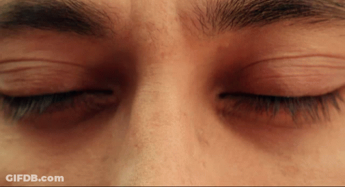 A Close Up Of A Person 'S Eyes With Their Eyelashes Closed GIF