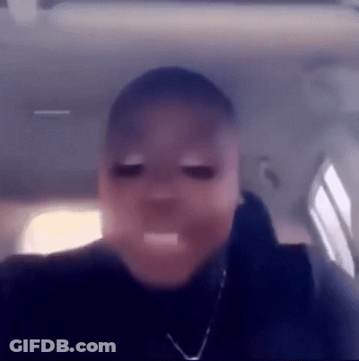 A Close Up Of A Person 'S Face In A Car With Their Mouth Open . GIF