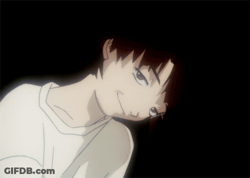 A Close Up Of A Person 'S Face In A Dark Room GIF