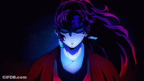 A Close Up Of A Person 'S Face In A Dark Room With Purple Hair And Earrings . GIF
