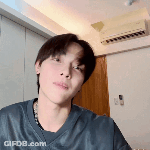 A Close Up Of A Person 'S Face In A Room With An Air Conditioner GIF
