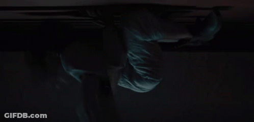A Close Up Of A Person 'S Face In The Dark With A Green Light Coming Out Of It . GIF