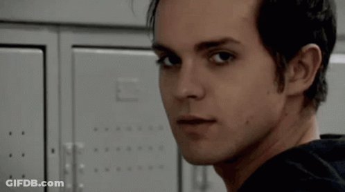 A Close Up Of A Person 'S Face Looking At Something GIF