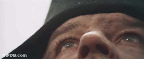 A Close Up Of A Person 'S Face Looking Up GIF
