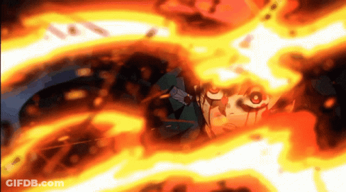 A Close Up Of A Person 'S Face Surrounded By Fire . GIF