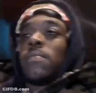 A Close Up Of A Person 'S Face Wearing A Hoodie And A Headband . GIF