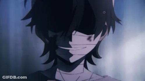 A Close Up Of A Person 'S Face With A Bandage Around His Mouth . GIF
