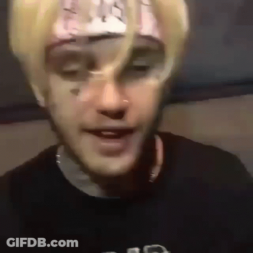 A Close Up Of A Person 'S Face With A Bandana On It . GIF