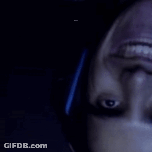 A Close Up Of A Person 'S Face With A Barcode In The Background That Says ' R & A ' GIF