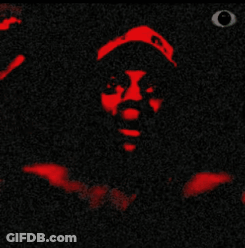 A Close Up Of A Person 'S Face With A Black Background And Red Lips GIF