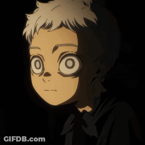 A Close Up Of A Person 'S Face With A Black Background GIF