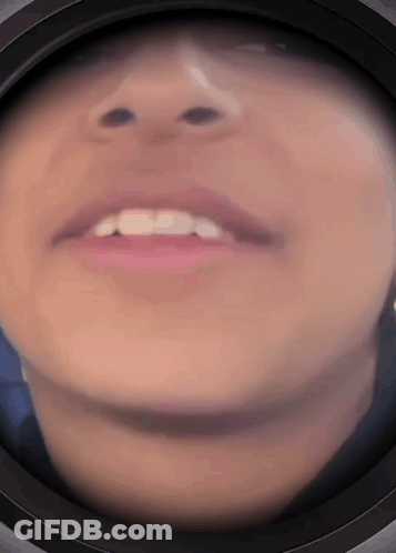 A Close Up Of A Person 'S Face With A Black Circle Around It GIF