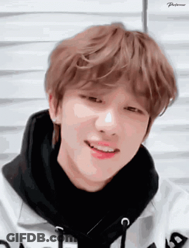A Close Up Of A Person 'S Face With A Black Scarf Around His Neck GIF