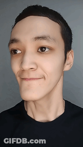 A Close Up Of A Person 'S Face With A Black Shirt GIF