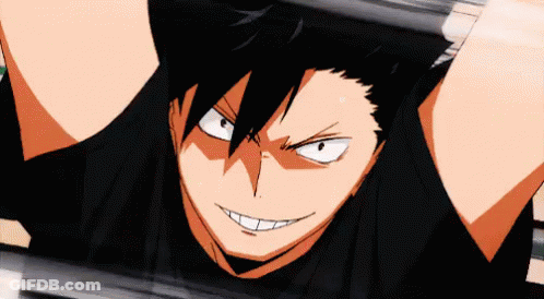 A Close Up Of A Person 'S Face With A Black Shirt On And A Smile On Their Face . GIF