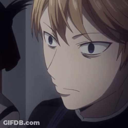 A Close Up Of A Person 'S Face With A Black Shirt On GIF