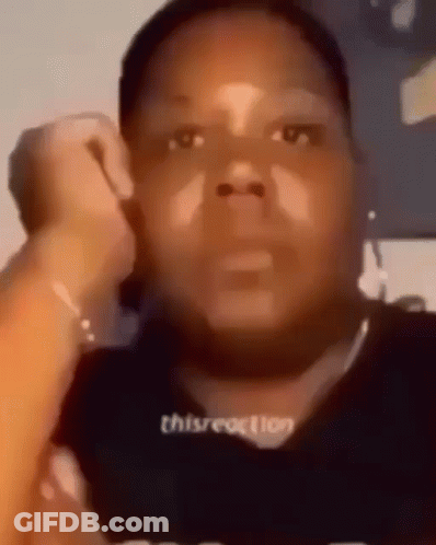 A Close Up Of A Person 'S Face With A Black Shirt On . GIF