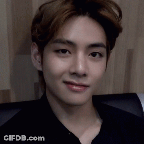 A Close Up Of A Person 'S Face With A Black Shirt On . GIF