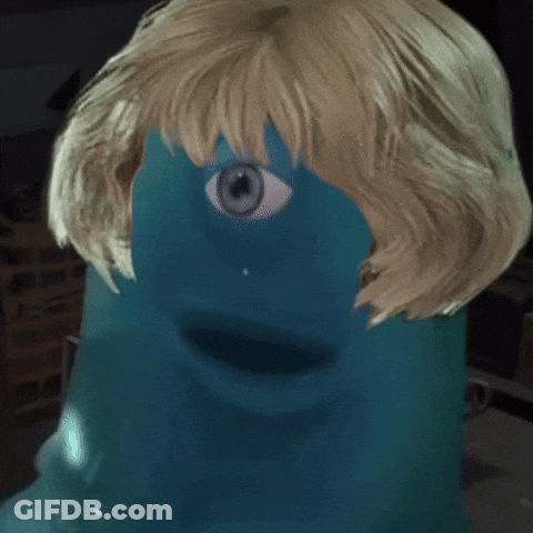 A Close Up Of A Person 'S Face With A Blue Eye And Blonde Hair GIF