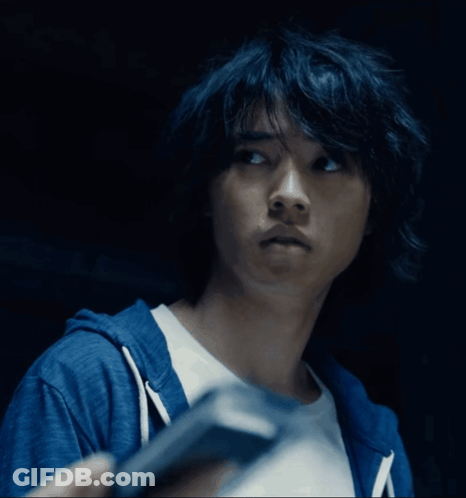 A Close Up Of A Person 'S Face With A Blue Hoodie GIF