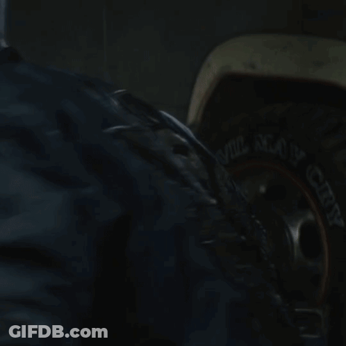 A Close Up Of A Person 'S Face With A Blue Jacket GIF