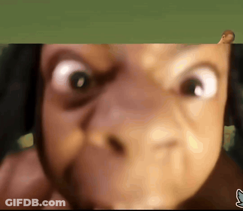 A Close Up Of A Person 'S Face With A Blue S On The Bottom GIF