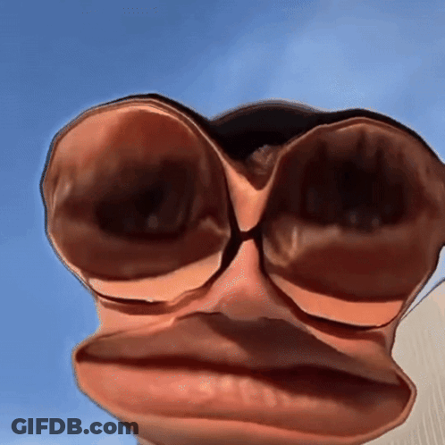 A Close Up Of A Person 'S Face With A Blue Sky Behind It GIF