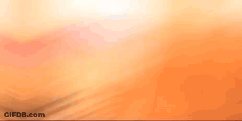A Close Up Of A Person 'S Face With A Blurred Background GIF