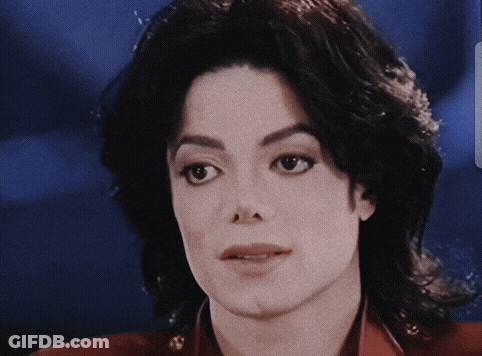 A Close Up Of A Person 'S Face With A Blurred Background GIF