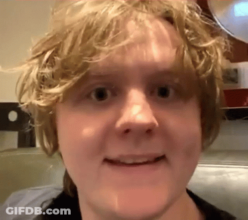 A Close Up Of A Person 'S Face With A Blurred Background GIF