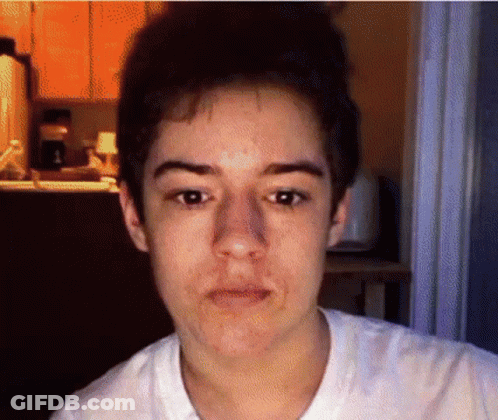 A Close Up Of A Person 'S Face With A Blurred Background GIF