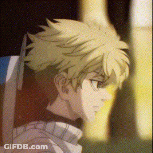 A Close Up Of A Person 'S Face With A Blurry Background And A Yellow Haired Anime Character . GIF