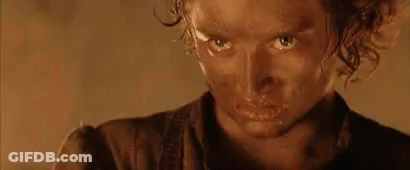 A Close Up Of A Person 'S Face With A Brown Shirt On GIF