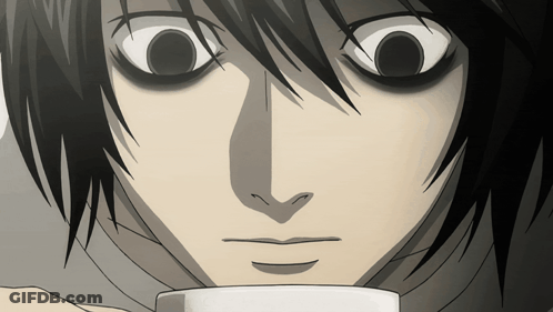A Close Up Of A Person 'S Face With A Cup In Front Of Them GIF