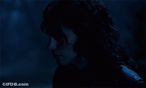 A Close Up Of A Person 'S Face With A Dark Background GIF