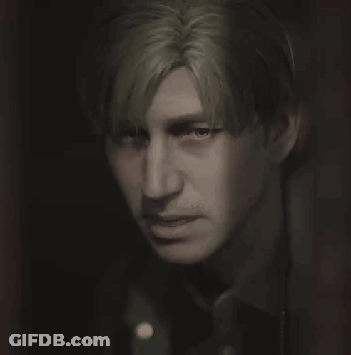 A Close Up Of A Person 'S Face With A Dark Background GIF
