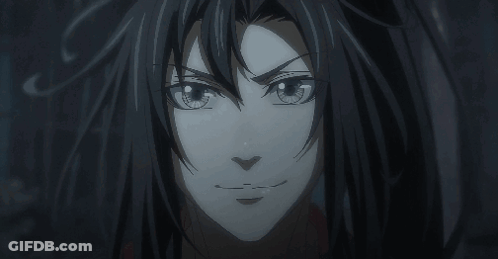 A Close Up Of A Person 'S Face With A Dark Background GIF