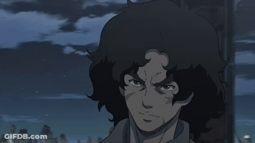 A Close Up Of A Person 'S Face With A Dark Background GIF