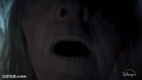 A Close Up Of A Person 'S Face With A Disney Logo GIF